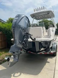 Slide: The Image of 2023 Solara S-250 DC boat with Yamaha outboard motor on a trailer. - 7