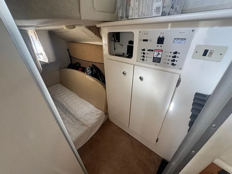 Slide: The Image of Interior cabin of 2001 Bayliner 2855 Ciera with control panel and sleeping area. - 12