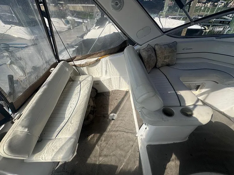 Slide: The Image of 2001 Bayliner 2855 Ciera interior with white seating and cup holders. - 14