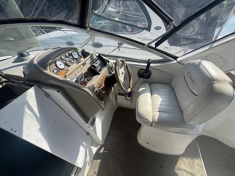 Slide: The Image of 2001 Bayliner 2855 Ciera boat cockpit with steering wheel and control panel. - 16