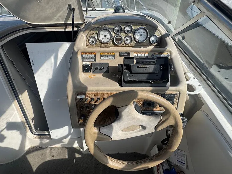 Slide: The Image of 2001 Bayliner 2855 Ciera boat dashboard with steering wheel and instrument panel. - 17