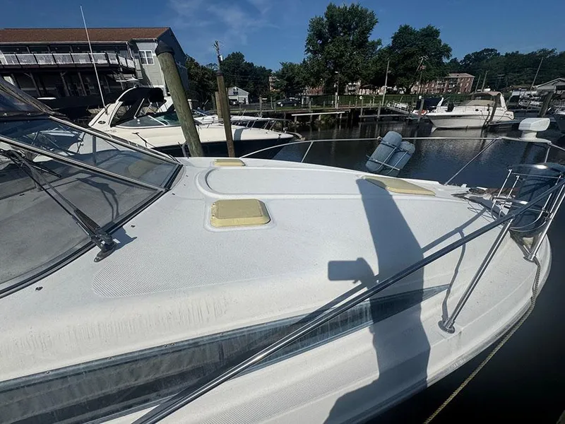 Slide: The Image of 2001 Bayliner 2855 Ciera boat docked at marina, sunny day, clear sky. - 5