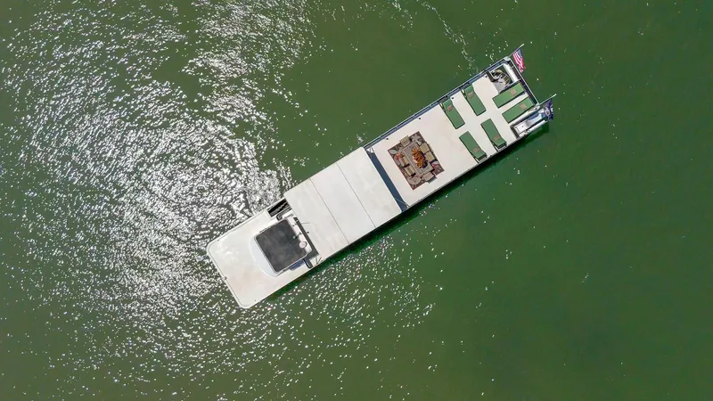 Slide: The Image of Aerial view of 2007 American Waterways Widebody boat on green water. - 11