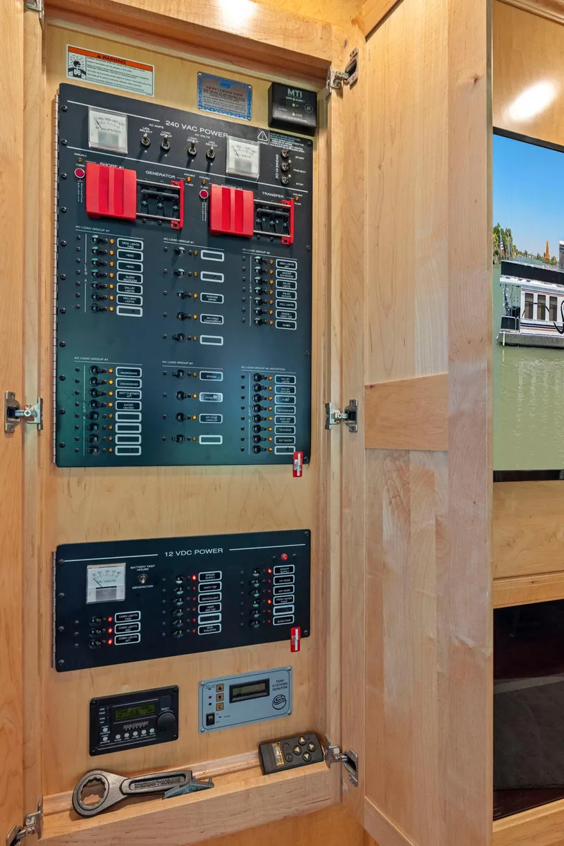 Slide: The Image of Electrical panel inside 2007 American Waterways Widebody boat, showcasing power controls and switches. - 26