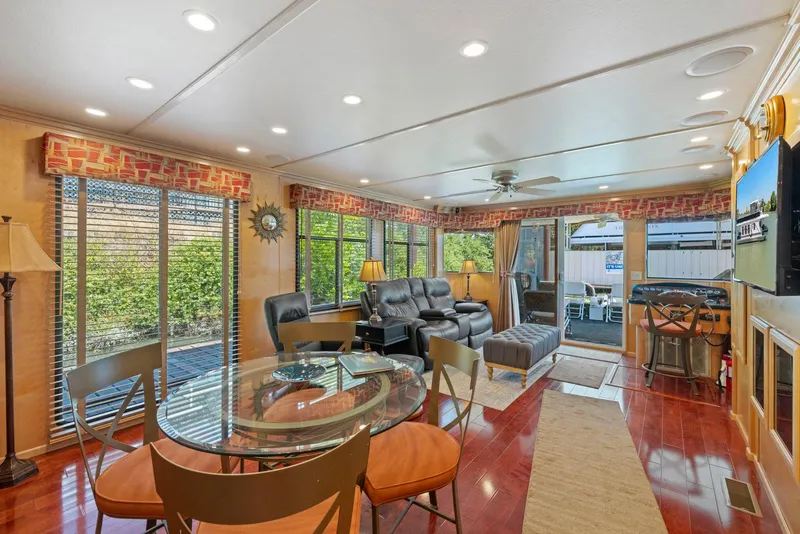 Slide: The Image of Luxurious 2007 American Waterways Widebody interior with modern furnishings and large windows. - 28