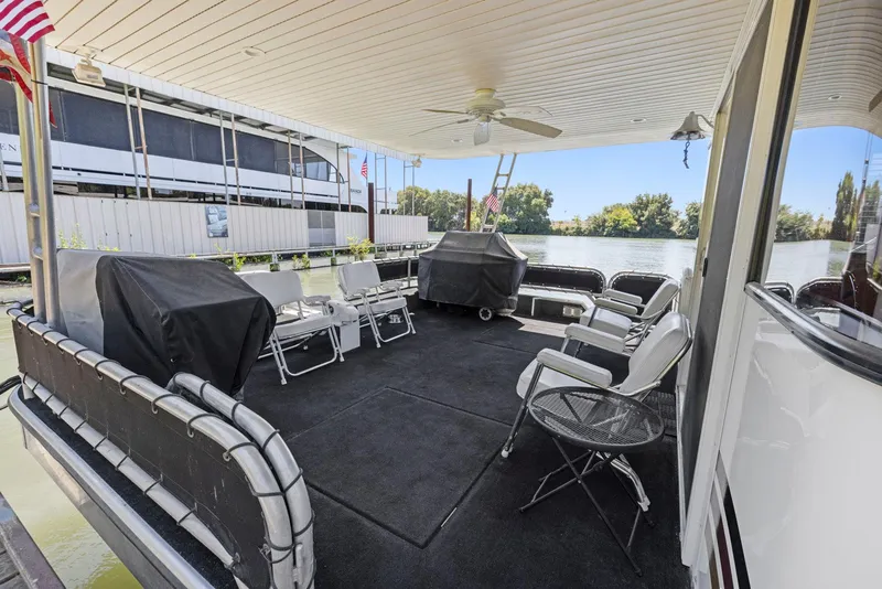 Slide: The Image of Spacious deck of 2007 American Waterways Widebody houseboat with seating and river view. - 36