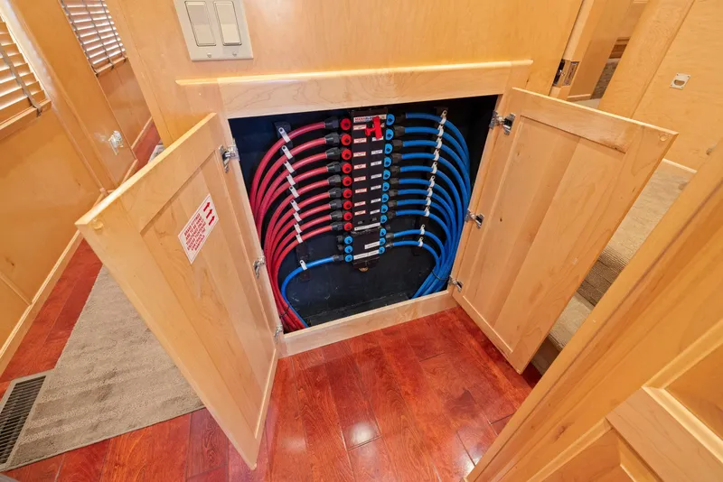 Slide: The Image of Water distribution system in a 2007 American Waterways Widebody boat, featuring organized red and blue pipes. - 39