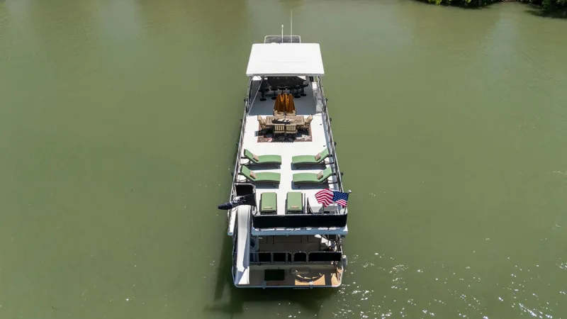 Slide: The Image of Aerial view of 2007 American Waterways Widebody boat on a calm river. - 4