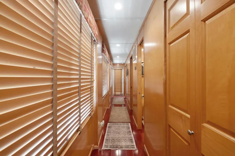 Slide: The Image of Hallway of 2007 American Waterways Widebody with wooden doors and blinds. - 46