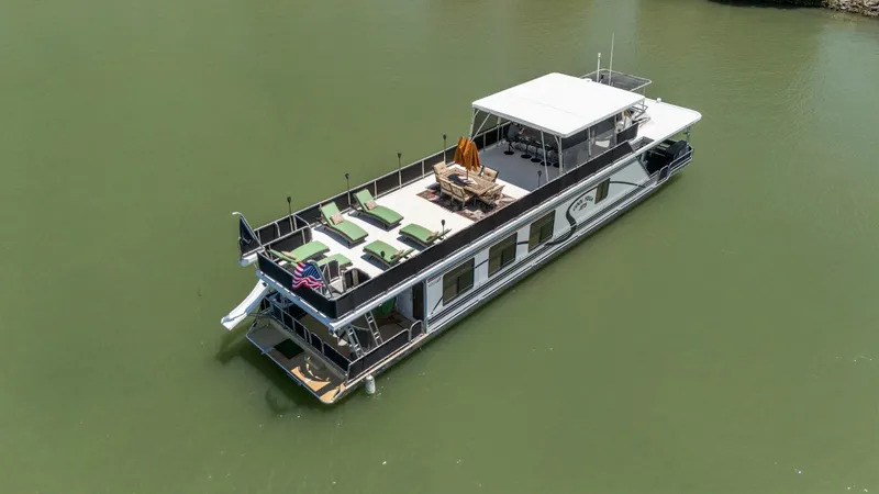 Slide: The Image of Houseboat on calm water, 2007 American Waterways Widebody, with sun deck and seating. - 5