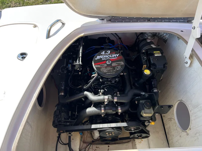 Slide: The Image of 2006 Tahoe 204 WT boat engine compartment with 4.3 Mercury motor. - 26