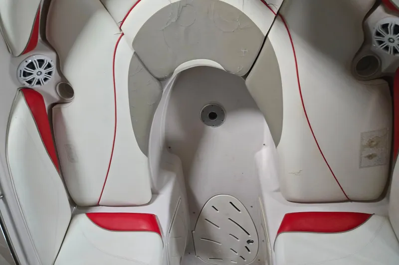 Slide: The Image of Interior of a 2006 Tahoe 204 WT boat with white and red seating. - 30