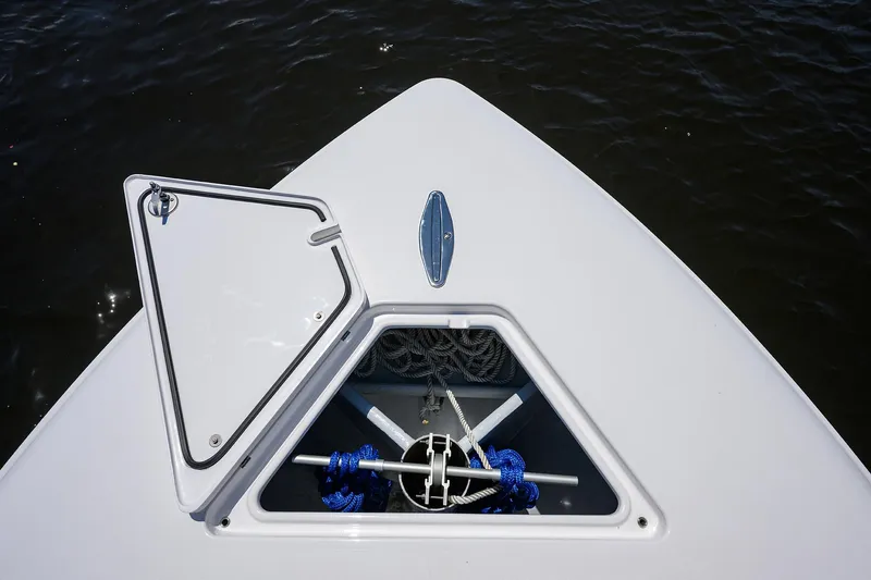 Slide: The Image of 2025 Contender 35 ST boat with open anchor hatch, showing ropes and anchor. - 13