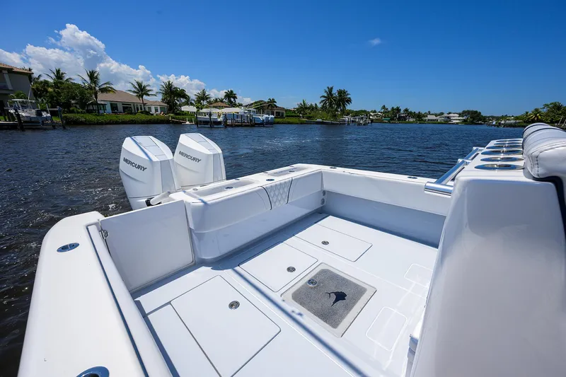 Slide: The Image of 2025 Contender 35 ST boat with Mercury engines on a sunny waterfront. - 25