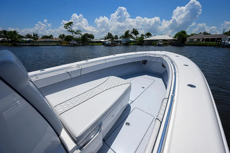 Slide: The Image of 2025 Contender 35 ST boat interior with seating, on a sunny day by the water. - 30