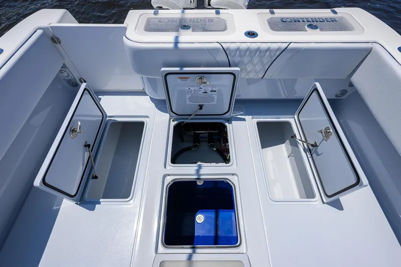 Slide: The Image of 2025 Contender 35 ST boat deck with open storage compartments and livewell. - 38