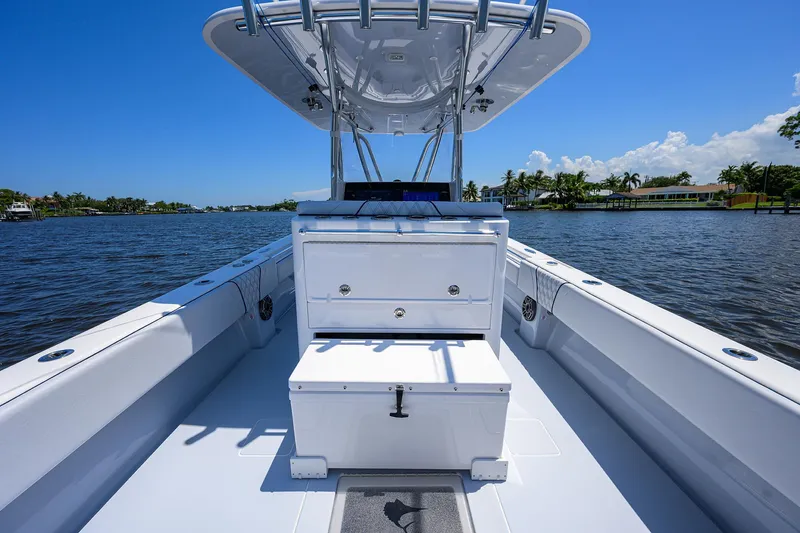 Slide: The Image of 2025 Contender 35 ST boat on a sunny day, showcasing sleek design and spacious deck. - 41