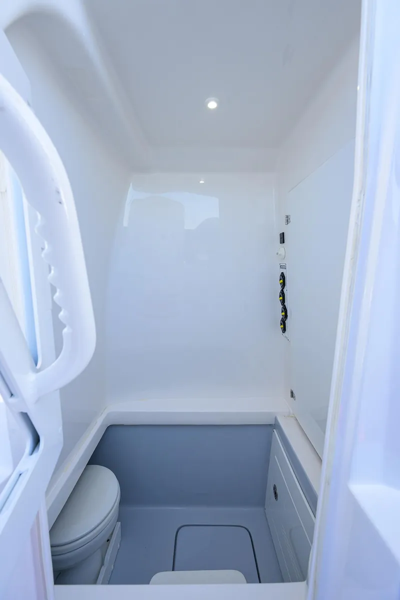 Slide: The Image of 2025 Contender 35 ST boat interior with compact bathroom and modern fixtures. - 42