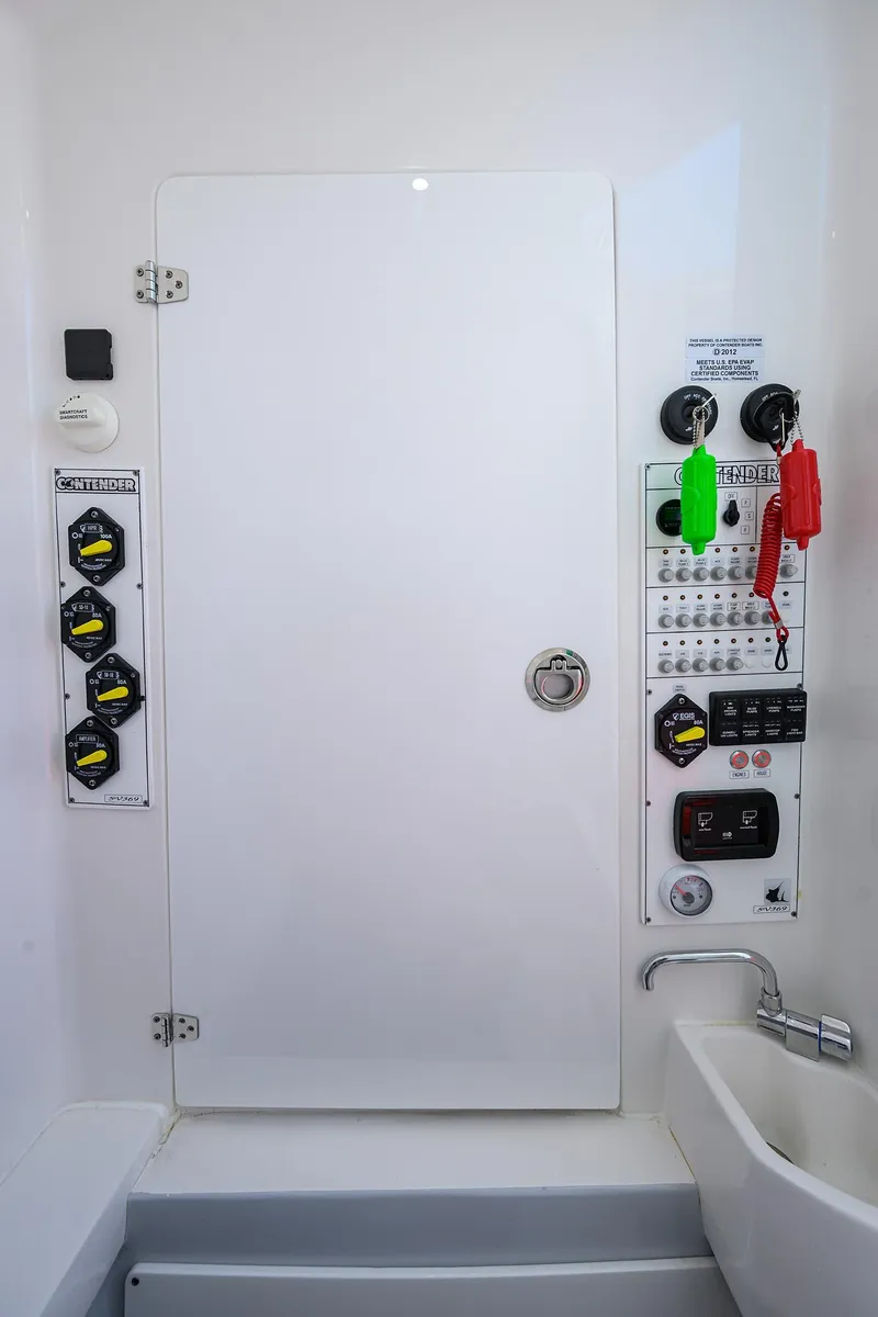 Slide: The Image of Control panel of 2025 Contender 35 ST boat, featuring switches and keys. - 45