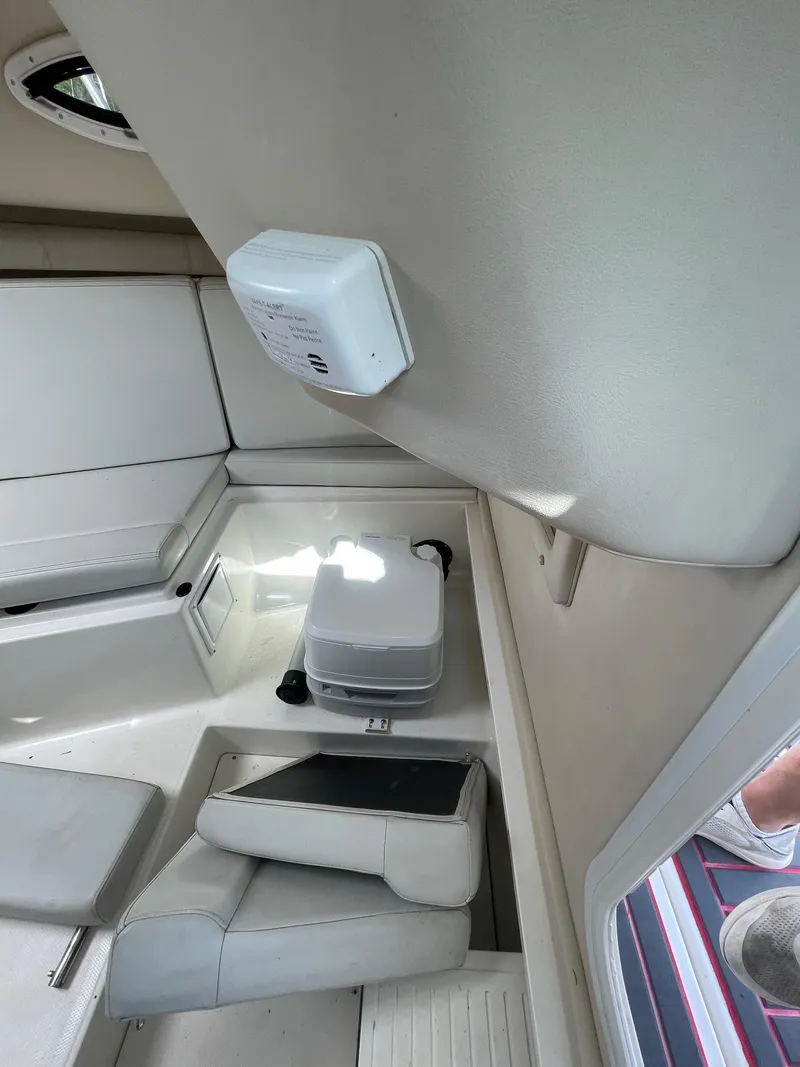 Slide: The Image of Interior of 2018 Striper 200 Walkaround boat with seating and storage area. - 12