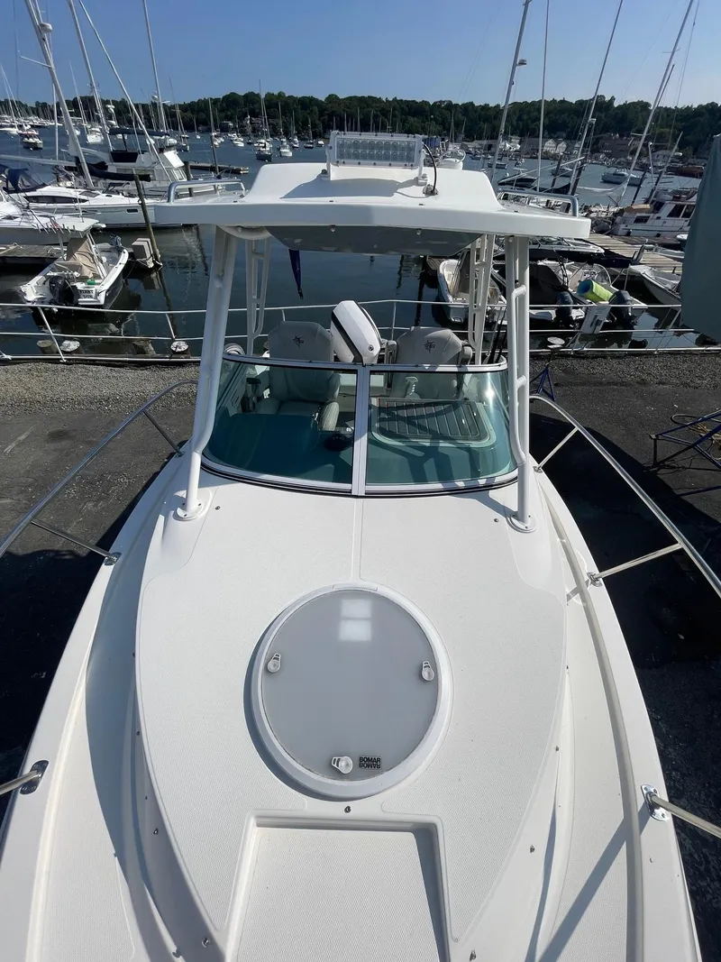 Slide: The Image of 2018 Striper 200 Walkaround boat docked at marina, top view. - 2