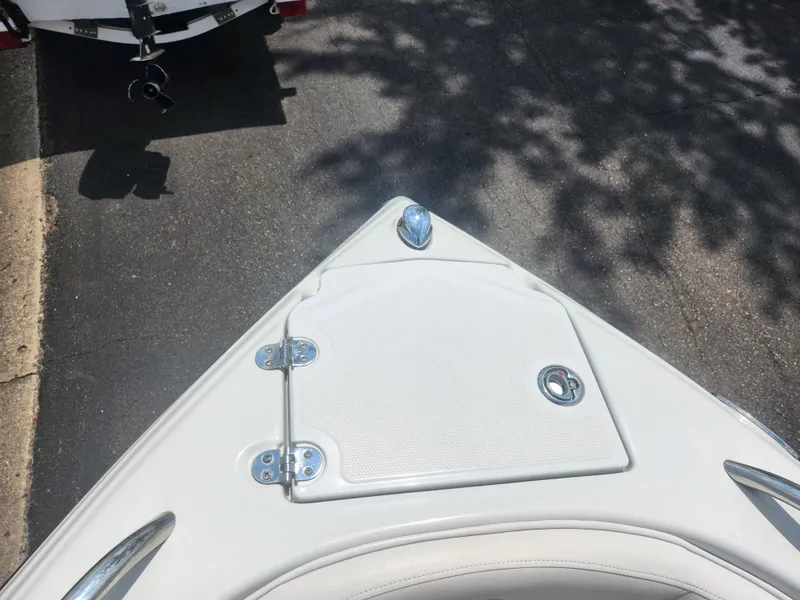 Slide: The Image of 2014 Crownline 21 SS boat bow with storage compartment. - 16