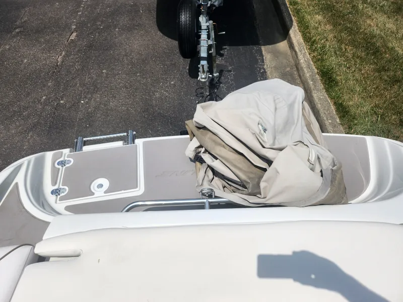 Slide: The Image of 2014 Crownline 21 SS boat with cover on trailer hitch. - 23