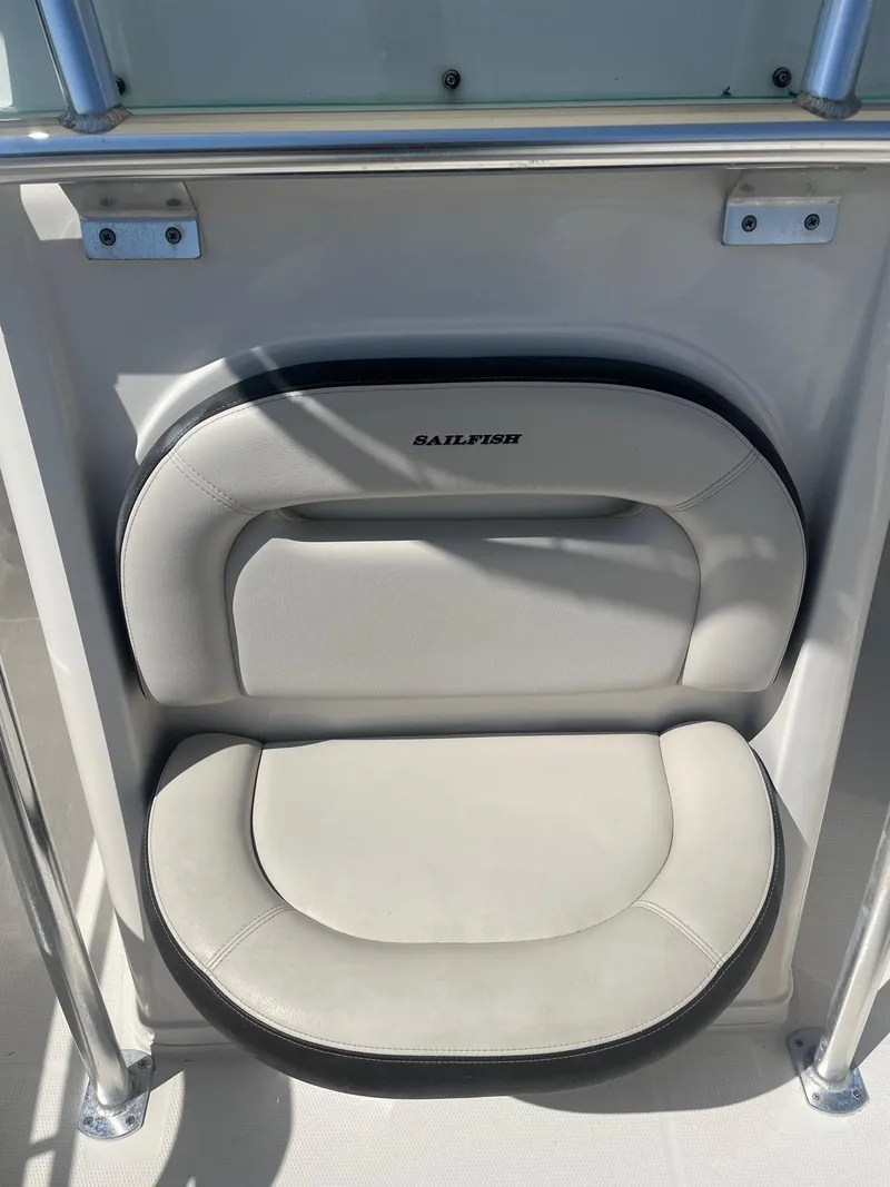 Slide: The Image of 2022 Sailfish 242 CC boat seat with logo, featuring sleek design and comfortable padding. - 8