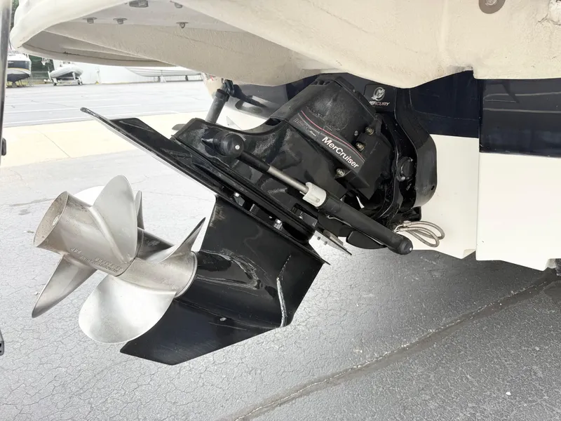 Slide: The Image of 2006 Sea Ray 240 Sundeck boat with MerCruiser outdrive and stainless steel propeller. - 6