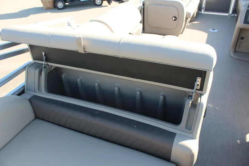 Slide: The Image of 2025 Sun Tracker Party Barge 22 RF DLX boat seat storage compartment open. - 11