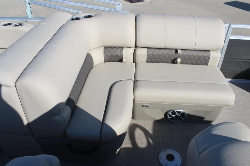 Slide: The Image of 2025 Sun Tracker Party Barge 22 RF DLX, luxurious seating with cup holders and speaker. - 13