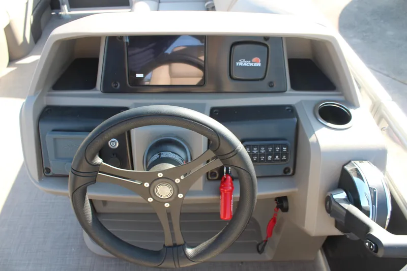 Slide: The Image of Steering console of 2025 Sun Tracker Party Barge 22 RF DLX pontoon boat. - 17