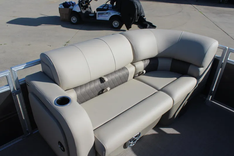 Slide: The Image of 2025 Sun Tracker Party Barge 22 RF DLX with plush seating and cup holder on deck. - 20