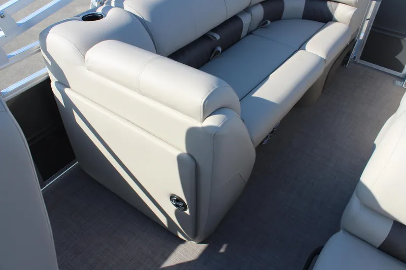 Slide: The Image of 2025 Sun Tracker Party Barge 22 RF DLX interior seating with beige upholstery. - 23
