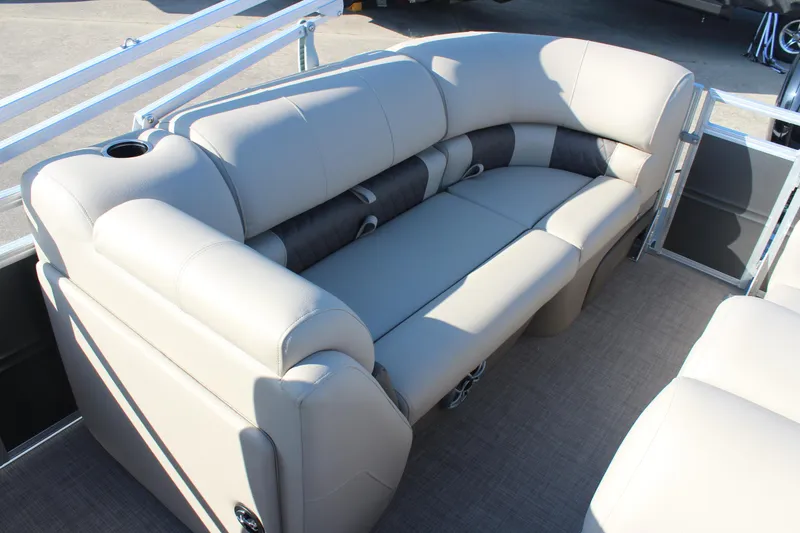 Slide: The Image of 2025 Sun Tracker Party Barge 22 RF DLX interior seating, beige upholstery, spacious and comfortable design. - 8