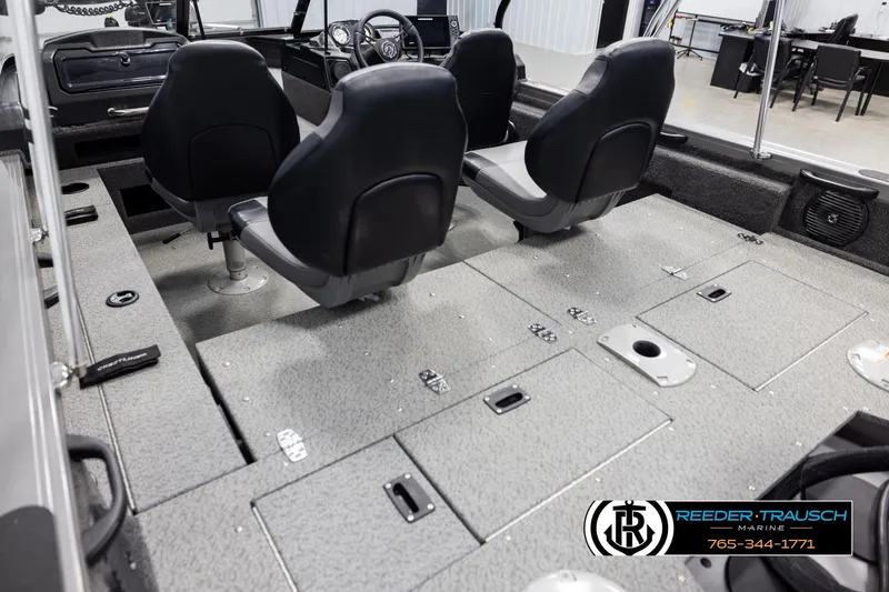 Slide: The Image of 2022 Crestliner 1850 FISHHAWK interior with seating and storage compartments. - 10