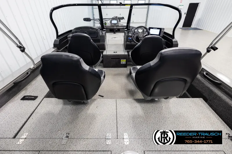 Slide: The Image of 2022 Crestliner 1850 FISHHAWK boat interior with dual black seats and control panel. - 12