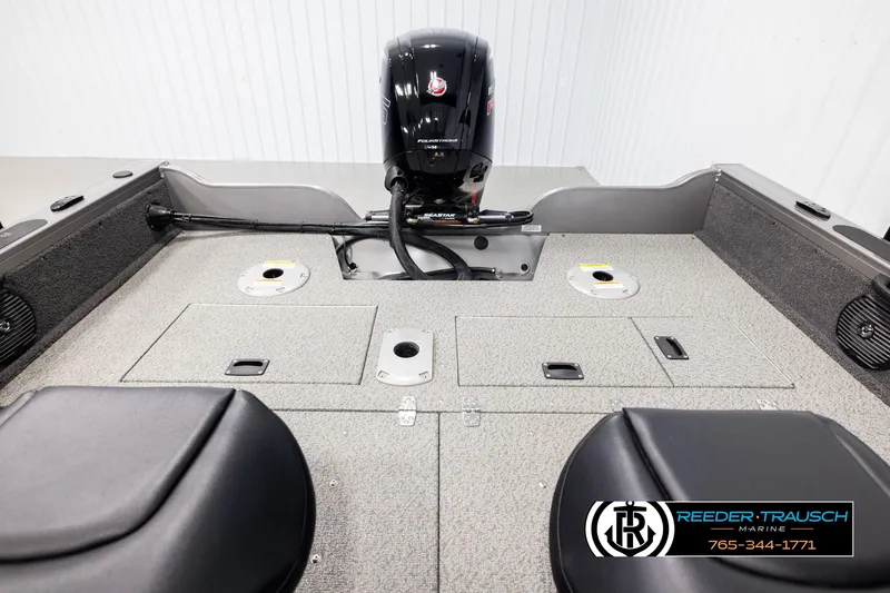 Slide: The Image of 2022 Crestliner 1850 FISHHAWK boat interior with motor, storage compartments, and seating. - 18