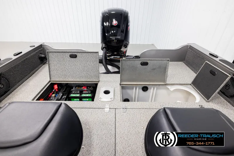 Slide: The Image of 2022 Crestliner 1850 FISHHAWK boat interior with storage compartments and motor. - 19