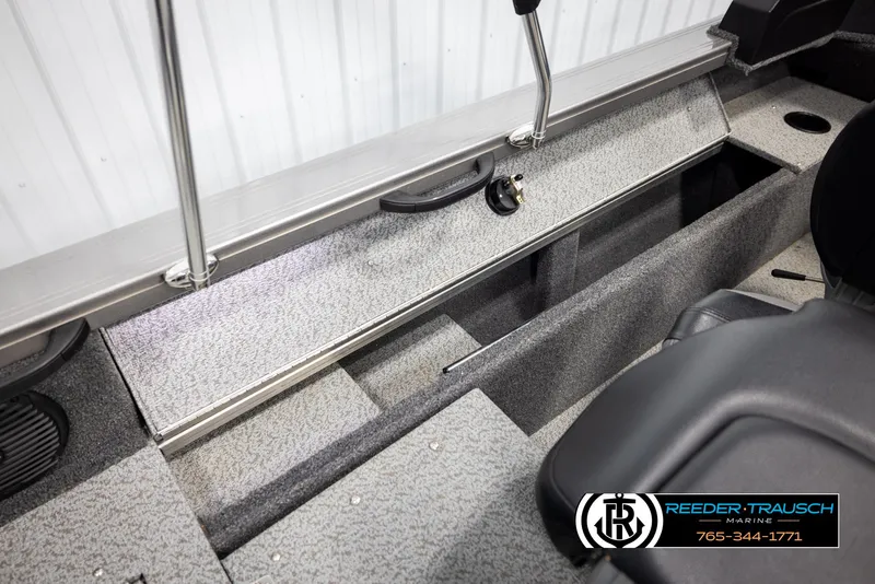 Slide: The Image of 2022 Crestliner 1850 Fishhawk boat interior with storage compartment and seating. - 23