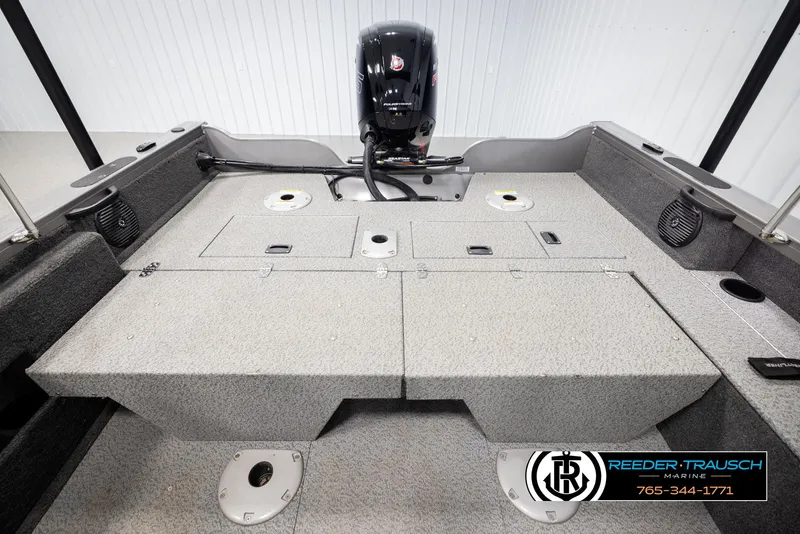 Slide: The Image of 2022 Crestliner 1850 FISHHAWK boat interior with motor, storage compartments, and speakers. - 24