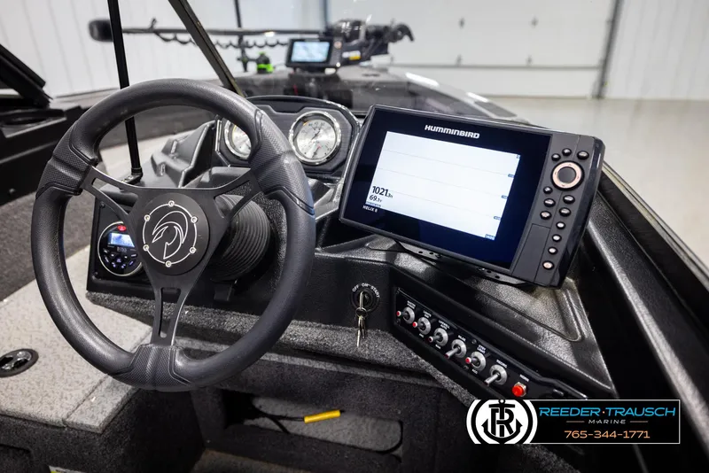 Slide: The Image of 2022 Crestliner 1850 FISHHAWK dashboard with steering wheel and Humminbird fish finder. - 27