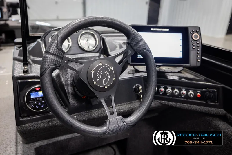 Slide: The Image of Steering console of 2022 Crestliner 1850 FISHHAWK with gauges and Humminbird display. - 28