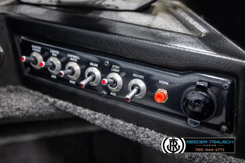 Slide: The Image of Control panel of 2022 Crestliner 1850 FISHHAWK boat with switches and labels. - 33
