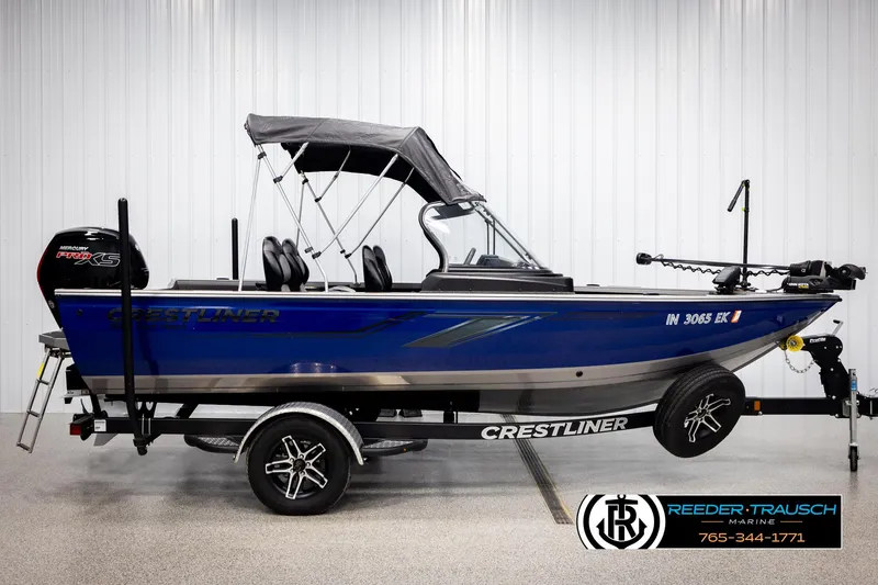 Slide: The Image of 2022 Crestliner 1850 FISHHAWK boat with canopy and trailer in showroom. - 4
