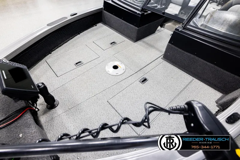 Slide: The Image of 2022 Crestliner 1850 FISHHAWK boat interior with storage compartments and control panel. - 9