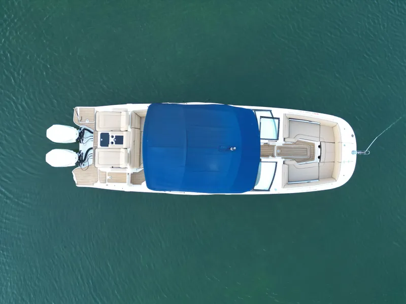Slide: The Image of Top view of 2021 Sea Ray SDX 290 Outboard boat on water. - 6