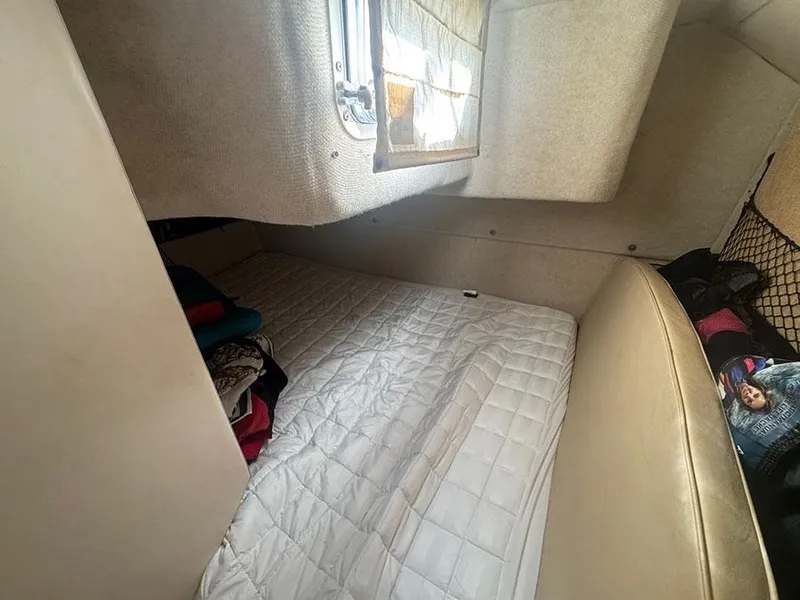 Slide: The Image of Interior cabin of 2001 Bayliner 2855 LX Sunbridge with bed and window. - 12