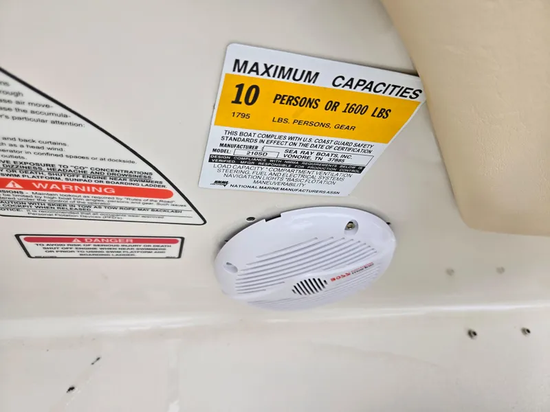 Slide: The Image of 2001 Sea Ray 210 Sundeck capacity label, maximum 10 persons or 1600 lbs. - 12