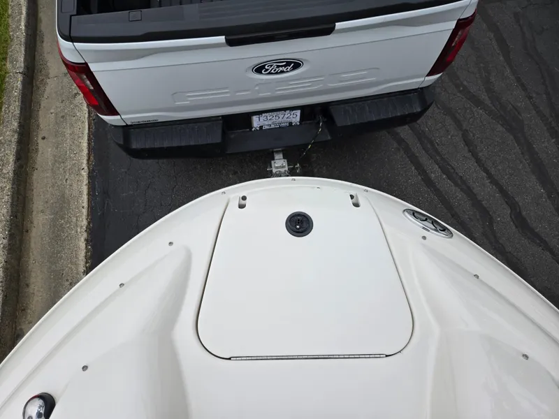 Slide: The Image of 2001 Sea Ray 210 Sundeck boat hitched to a Ford truck, viewed from above. - 18